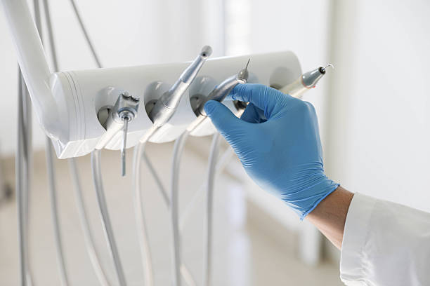Professional Tooth Extraction technician working in Champaign, IL